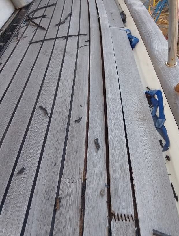 Weathered original teak deck before removal and replacement