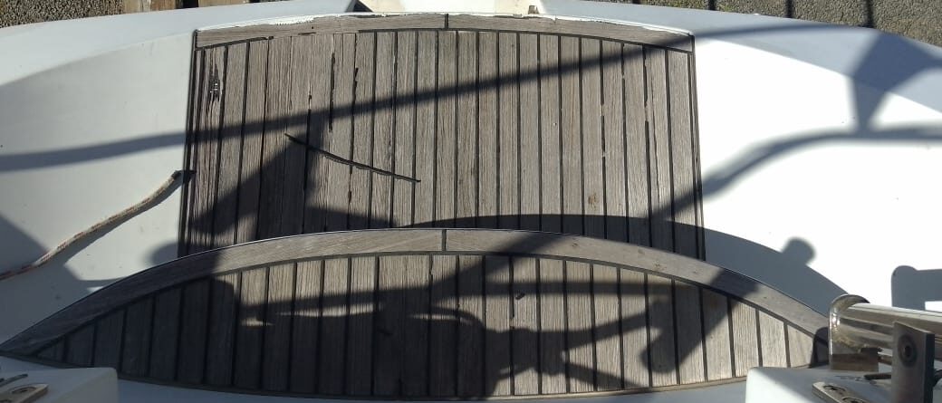 Weathered wooden teak companionway steps before rebuild
